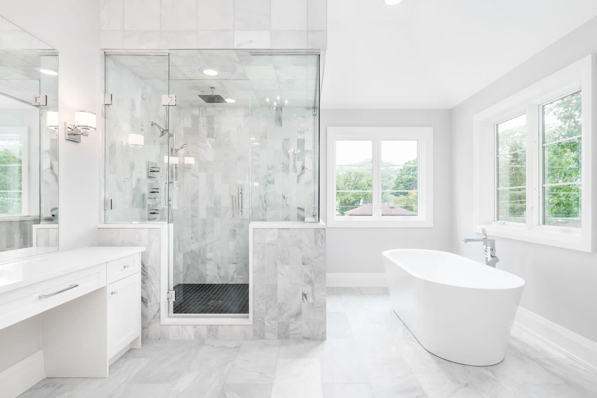 bathroom with tub and glass shower