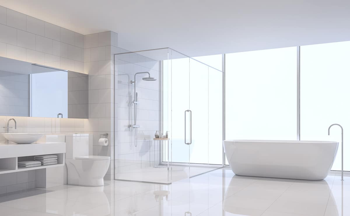 bright bathroom with tub shower and toilet
