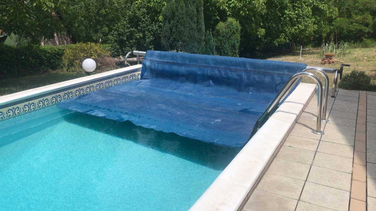 pool with cover and deck