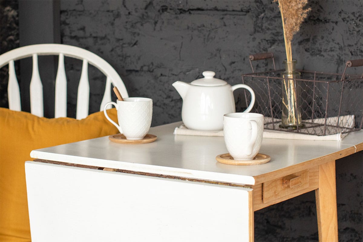 Small table with teapot and coaster