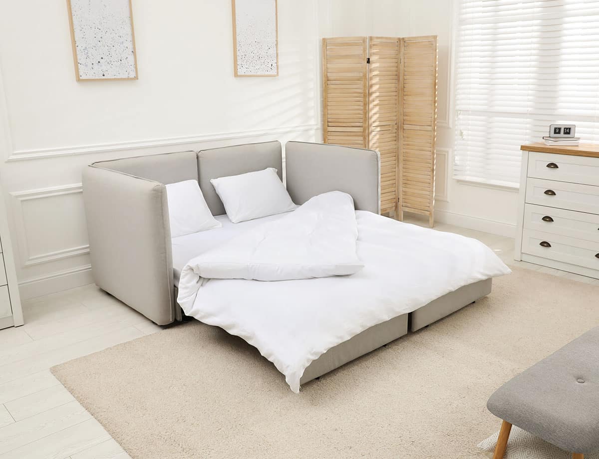 Sleeper sofa beige paint room wood divider blinds