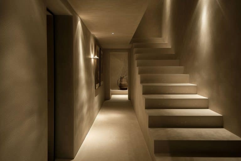 dimly lit hallway inside modern house with no window
