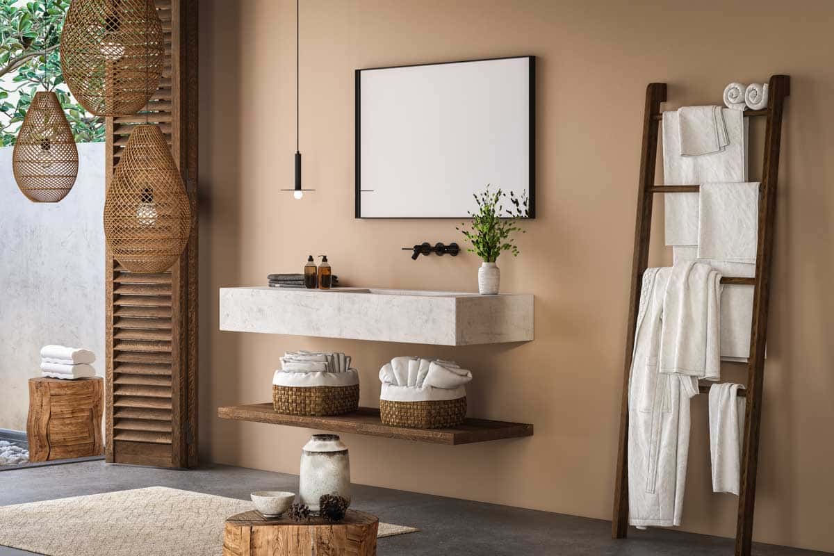 light brown bathroom with floating counter and ladder