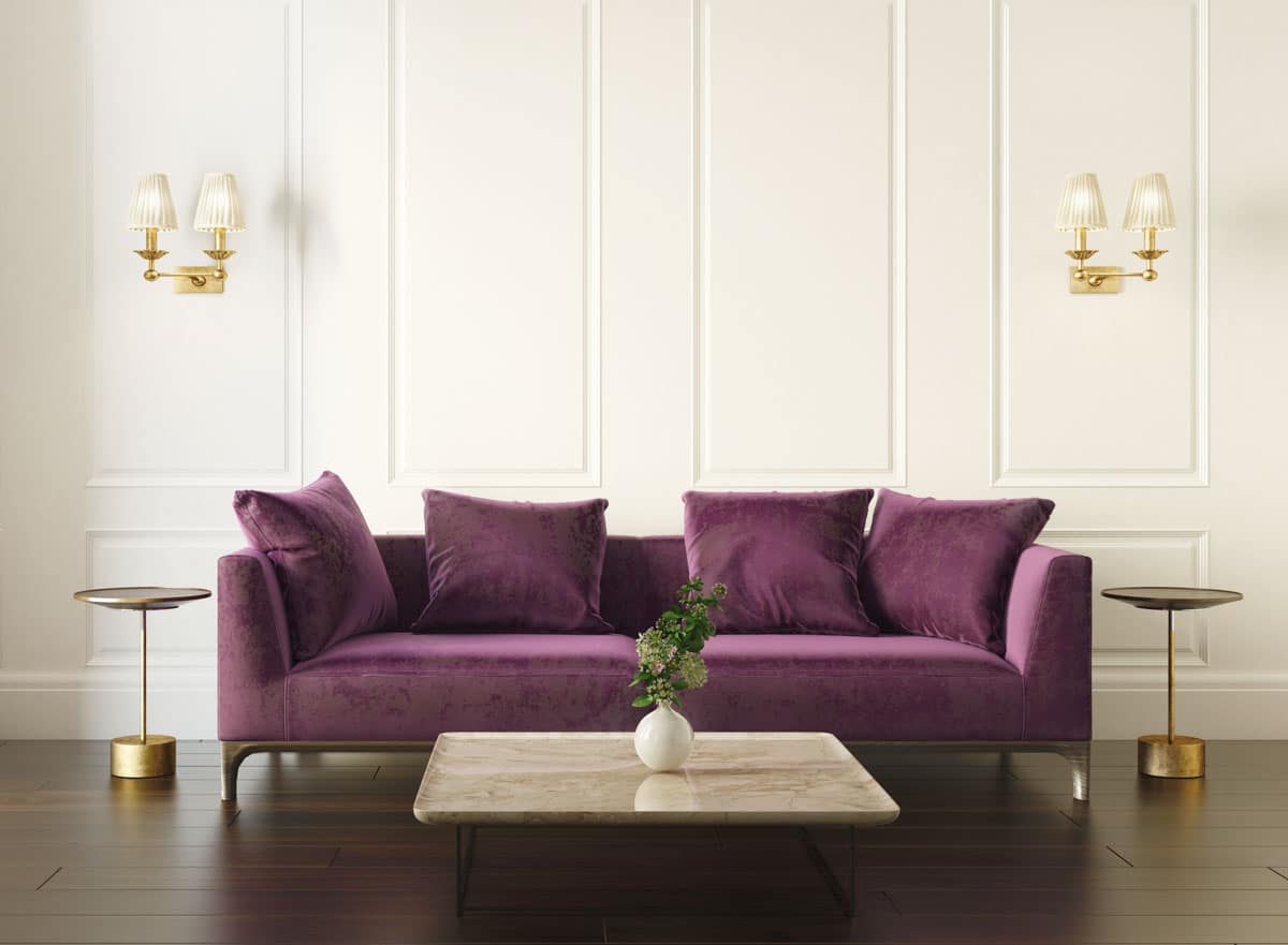 room with white walls and purple sofa