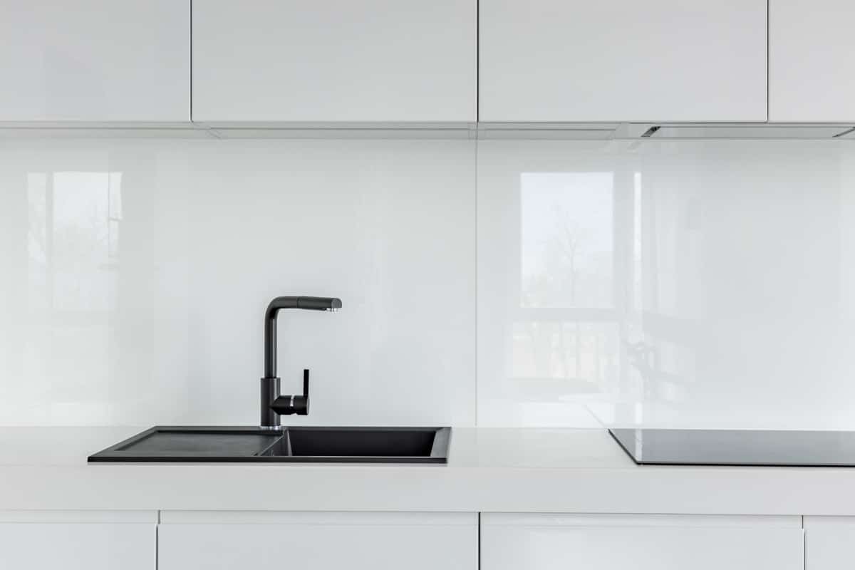 white kitchen with composite sink