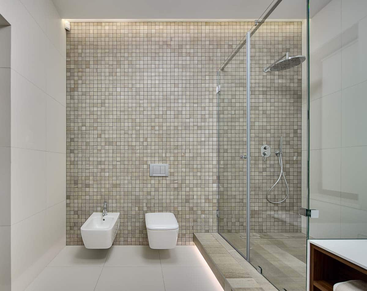 bathroom with mosaic tile wall and shower