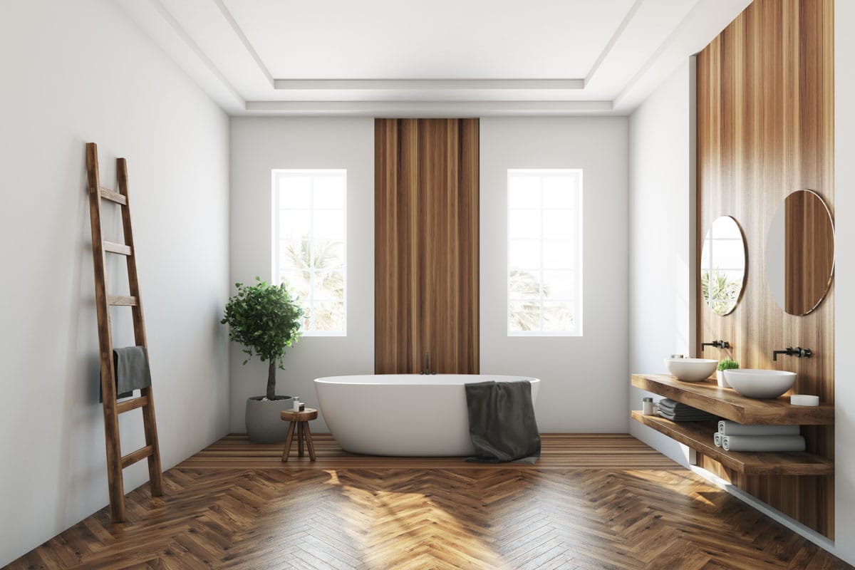 bathroom with parquet wood flooring and tub
