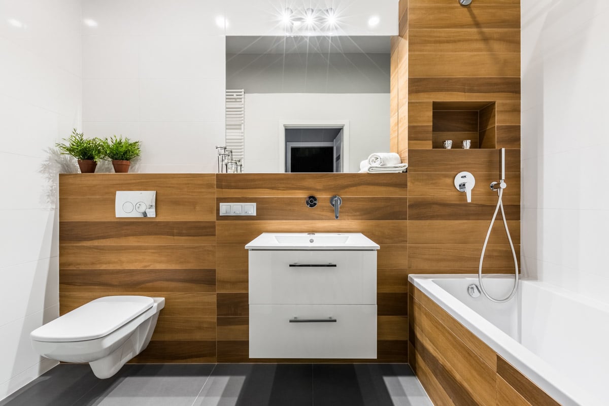 bathroom with wood walls and indoor plant