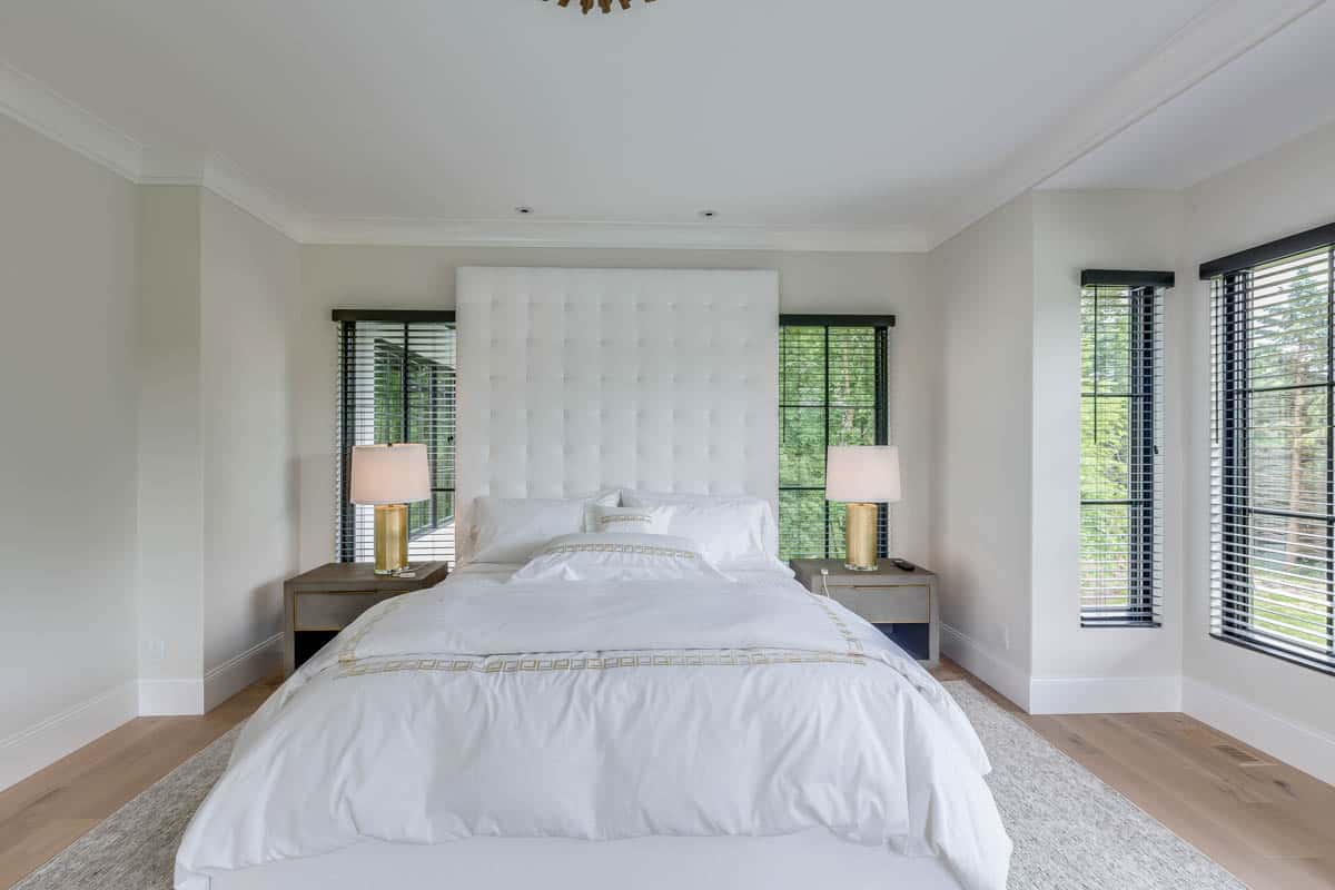 bedroom with trim and white walls