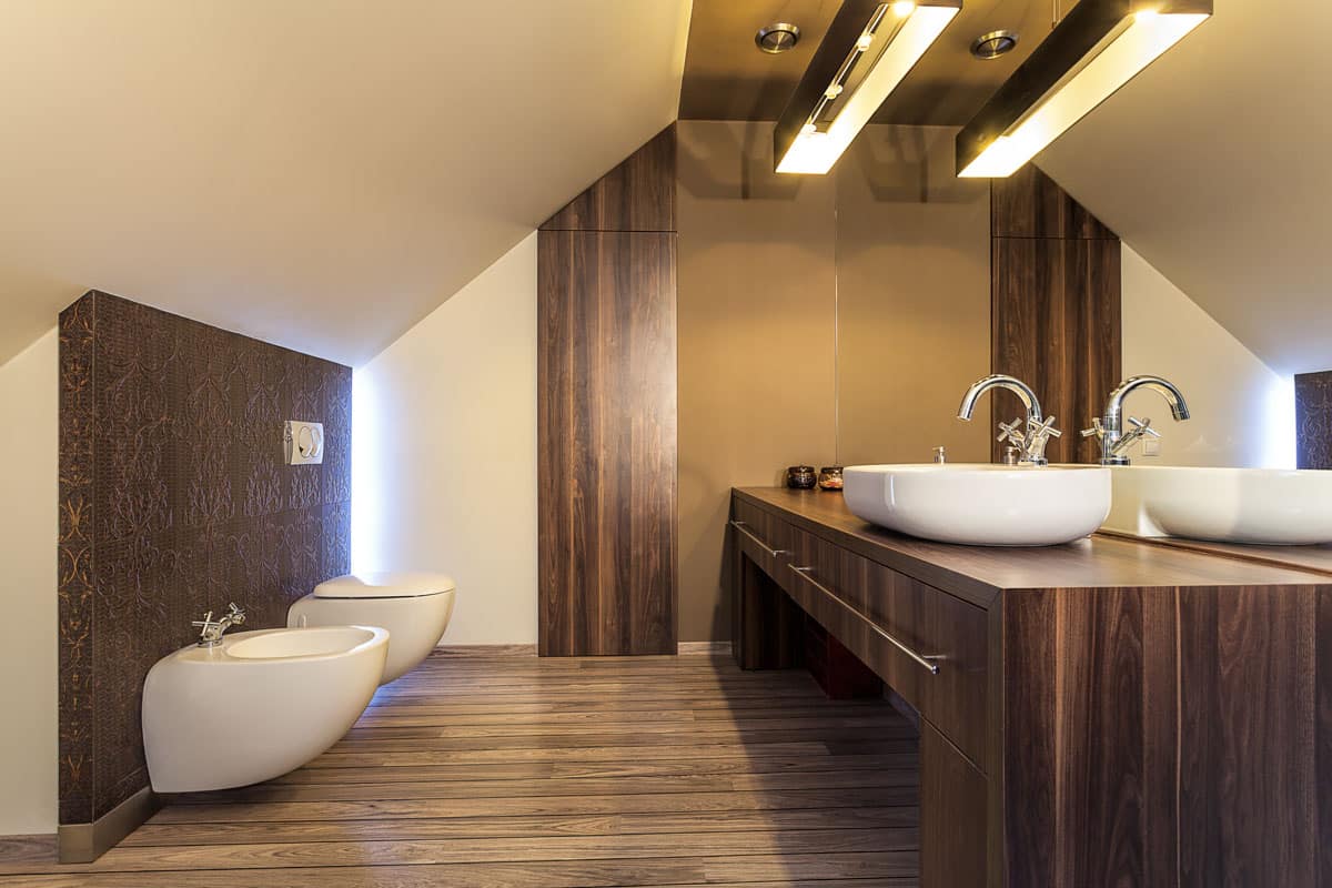 brown bathroom with wood flooring and sink