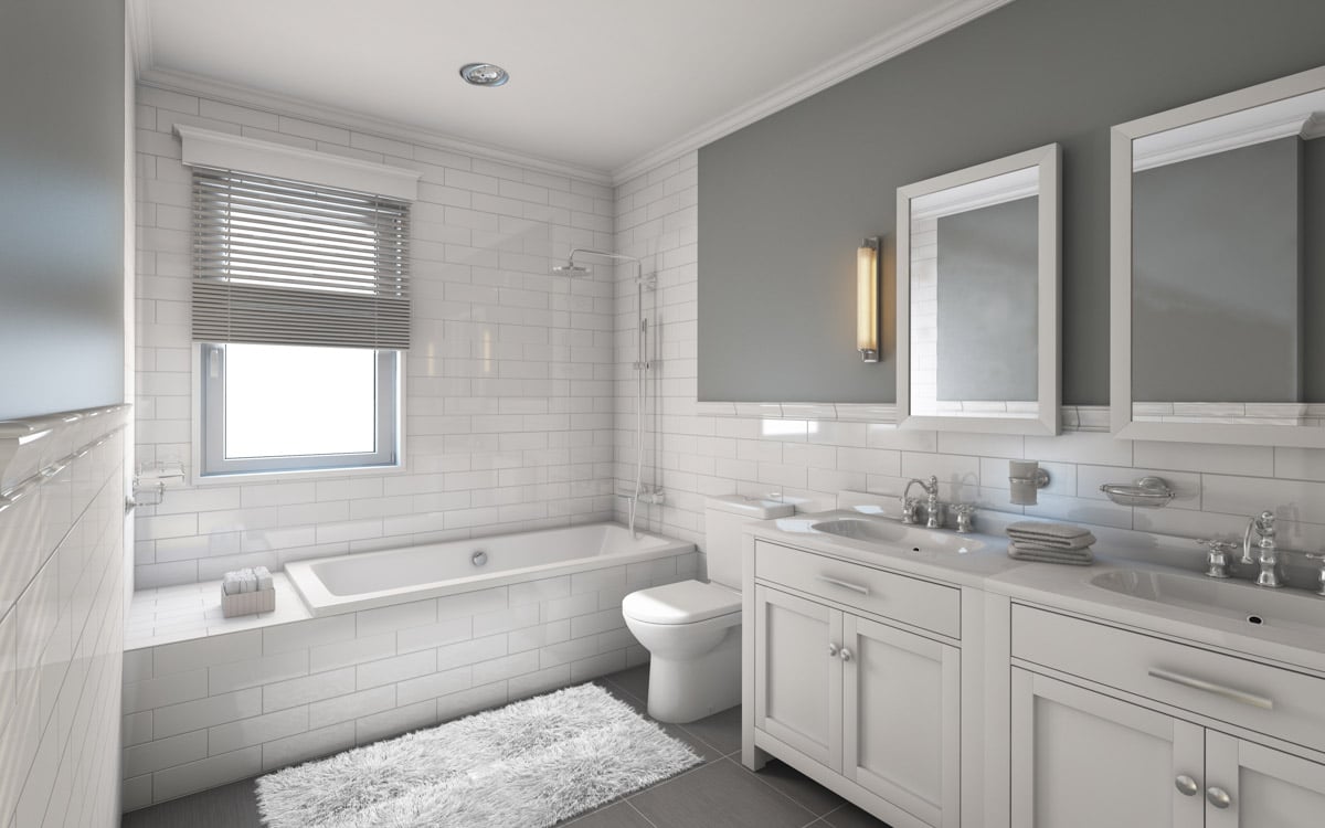 gray bathroom with tub subway tiles and mirrors