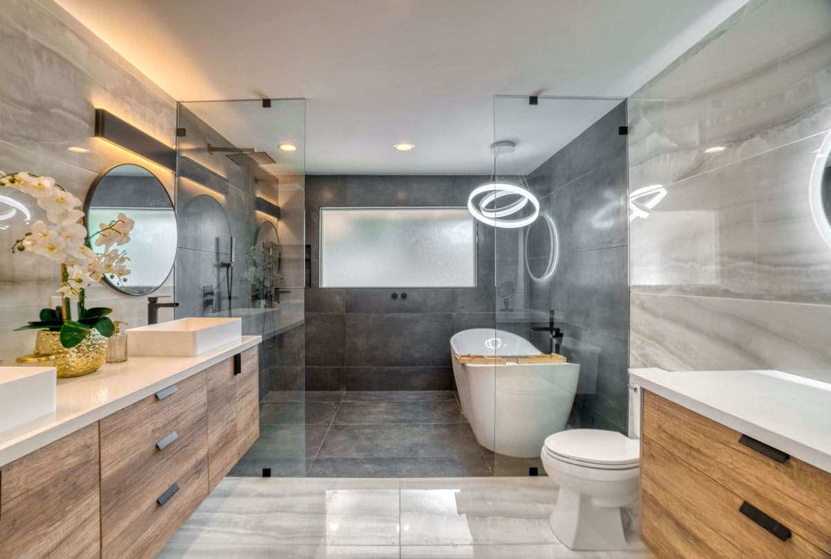 luxury bathroom with large format tile walls and toilet