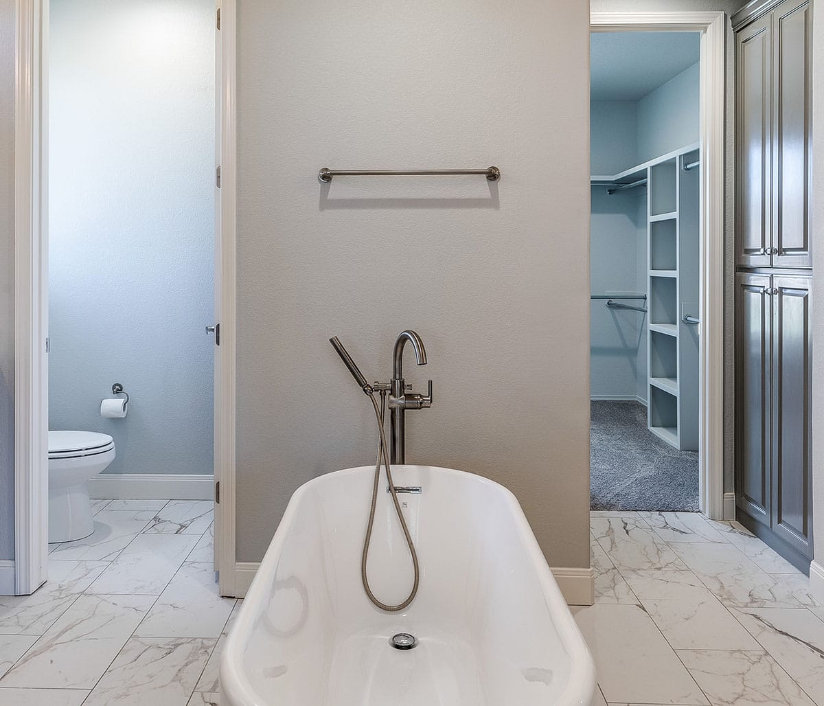 Bathroom with freestanding tub gray paint