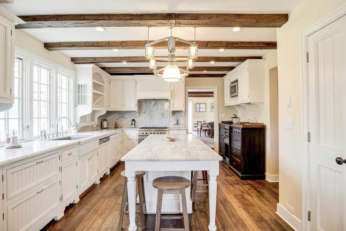 Traditional kitchen with center island and exposed wooden beams