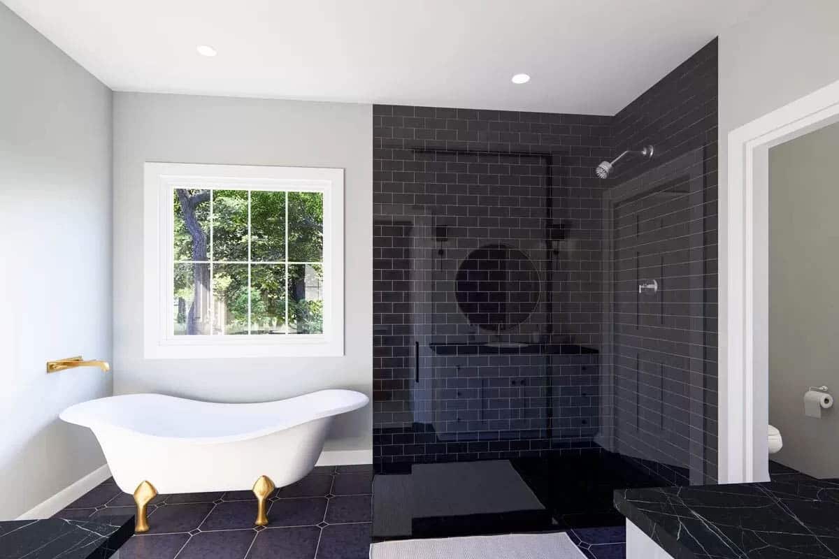 Bathroom with black tile walk in shower ballfoot tub