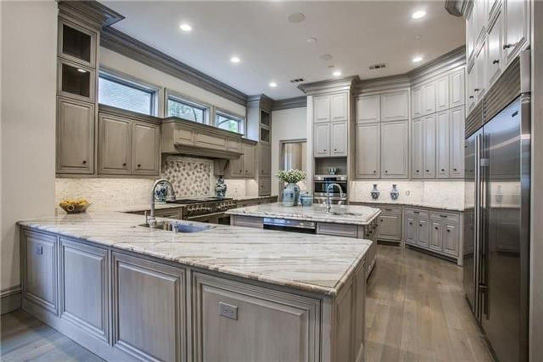 Contemporary kitchen with island and peninsula and granite counters