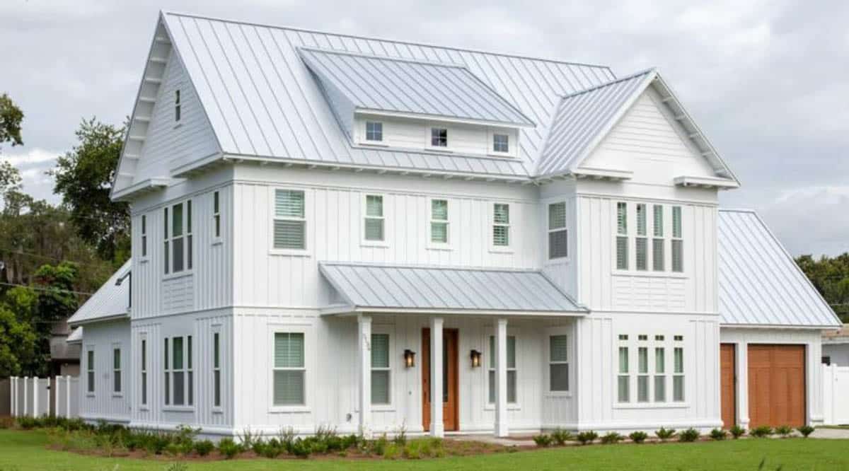 Country home with board and batten siding and white paint with covered porch