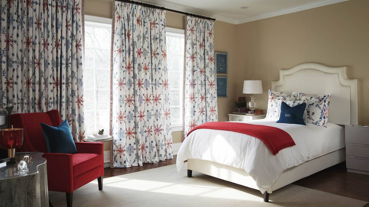 Festive bedroom with snoflake themed insulated curtains