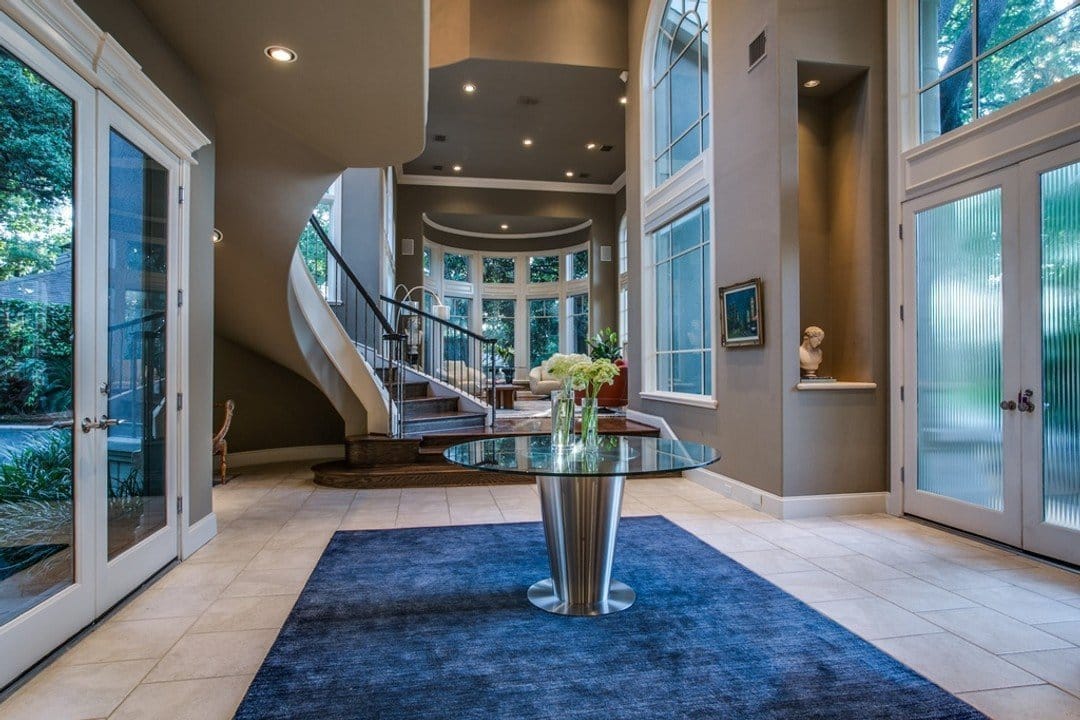 Sophisticated entryway with textured glass doors