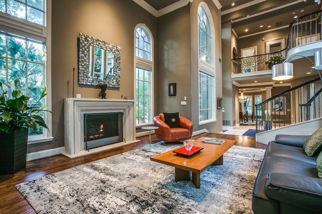 Grand living area with high ceilings and fireplace