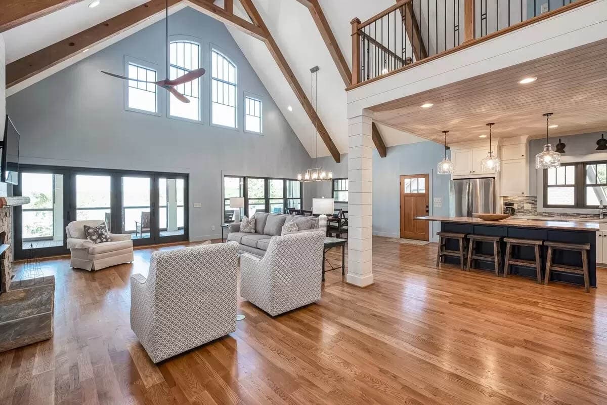 Waterfront living room with cathedral ceiling and open plan