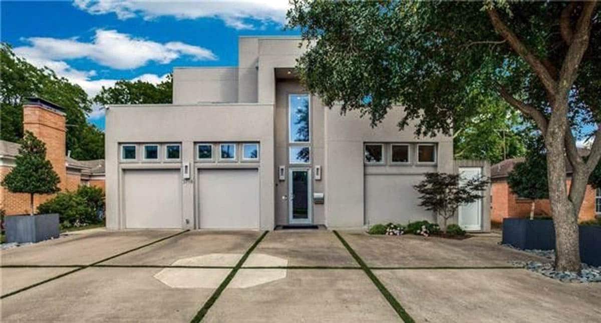 Contemporary home with gray exterior and 2 car garage