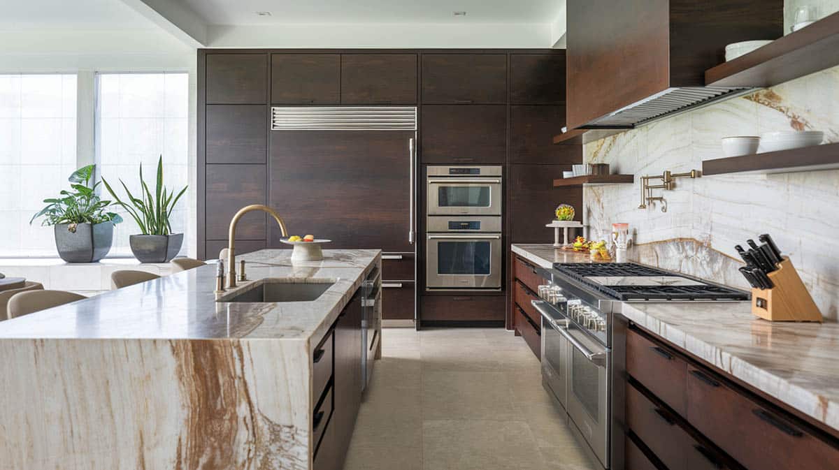 Contemporary kitchen with espresso cabinets and marble countertops and backsplash