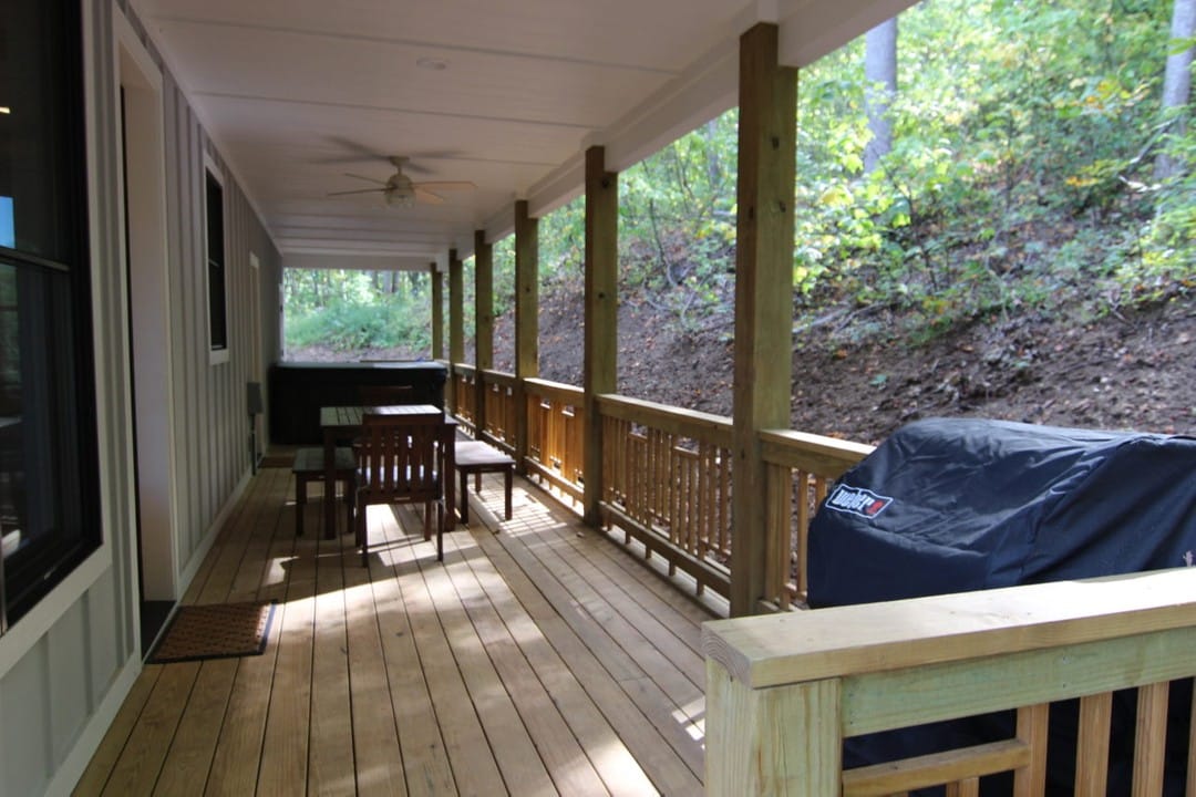 Covered back deck with hot tub and barbecue