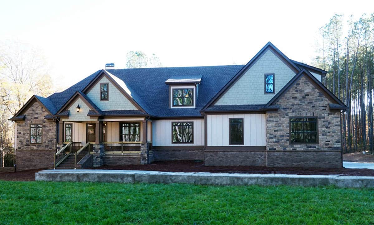 Craftsman style house with gables and stone facade