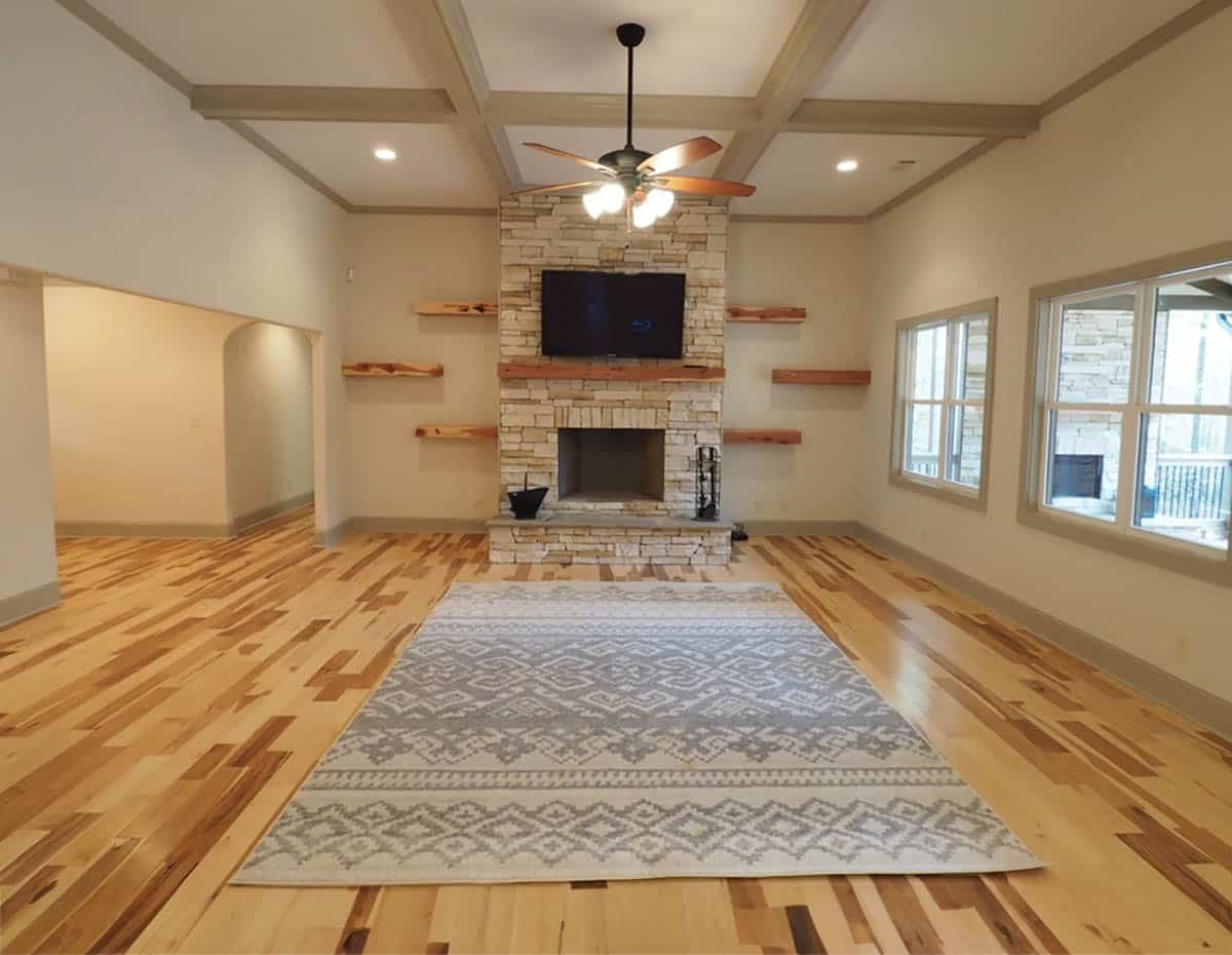 Craftsman living room with stone fireplace and wood mantel