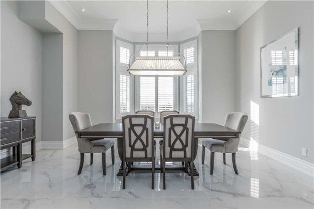 Modern dining space with elongated chandelier