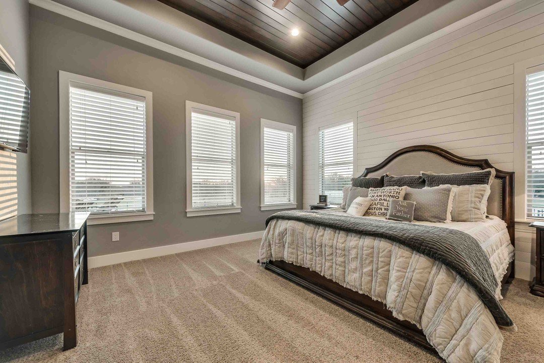 Primary bedroom with shiplap walls