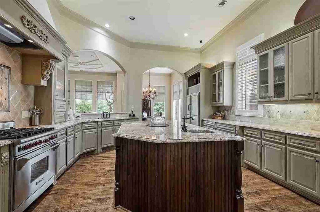 Mediterranean kitchen with raised panel cabinets