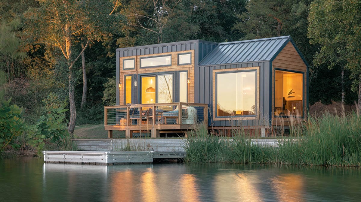 Tiny lake home with large windows and dock