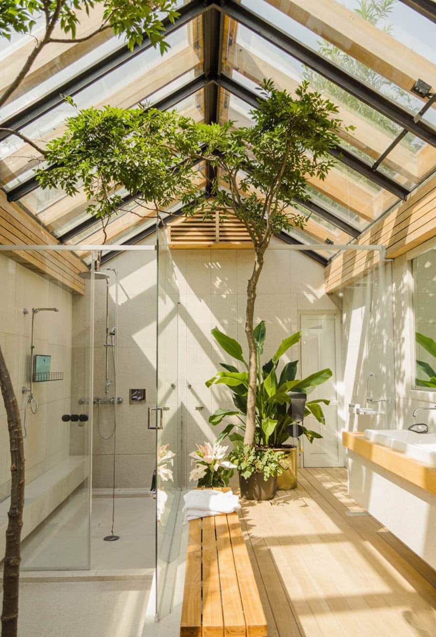 Tropical bathroom with glass shower exposed ceiling beams