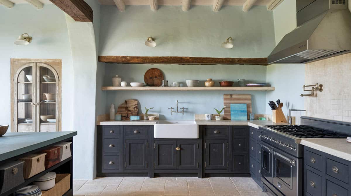 Coastal kitchen with charcoal color cabinets and pale blue gray walls