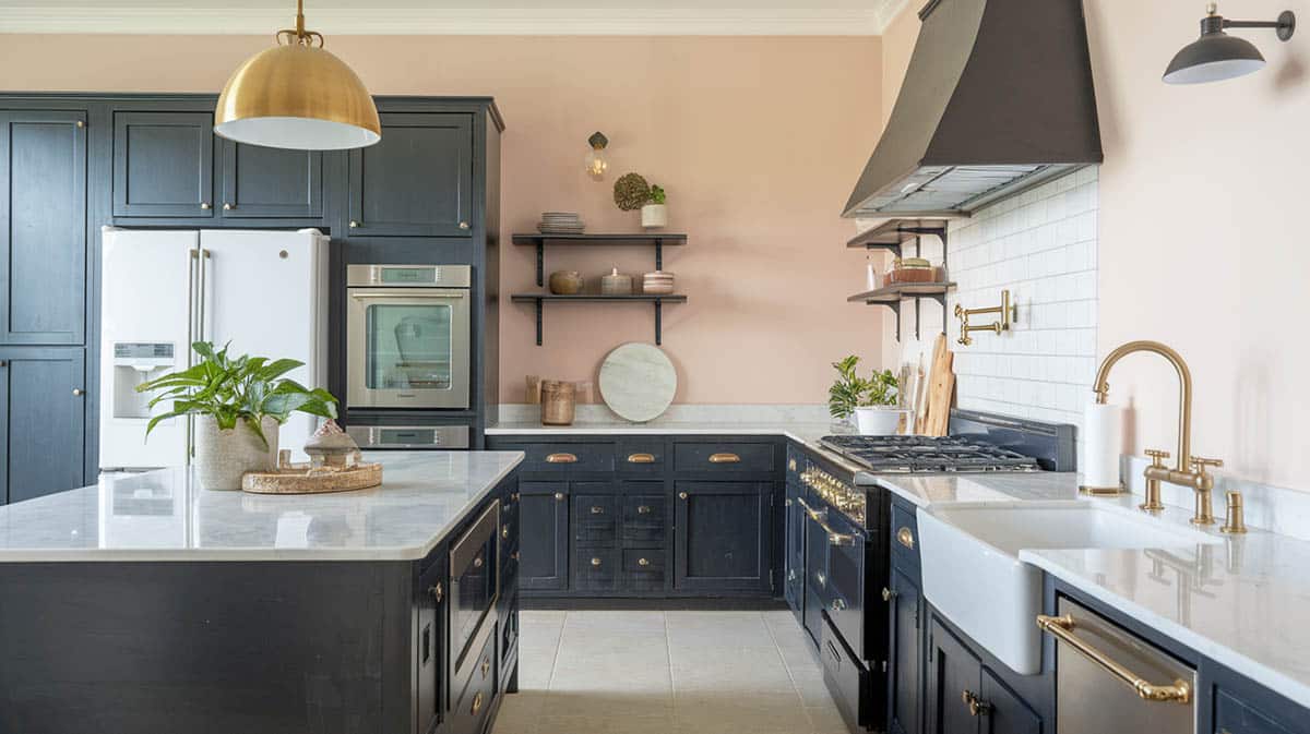 Beautiful kitchen with walls in pale blush and cabinets in charcoal