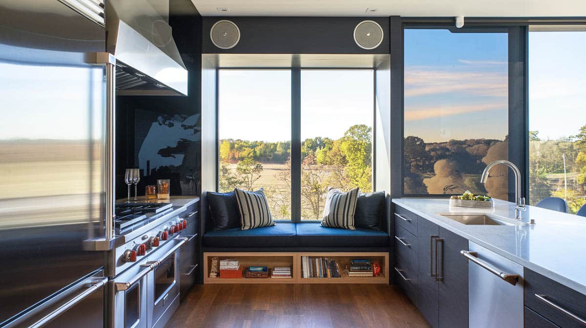 High tech kitchen with modular seat with removable cushions cabinets and storage below