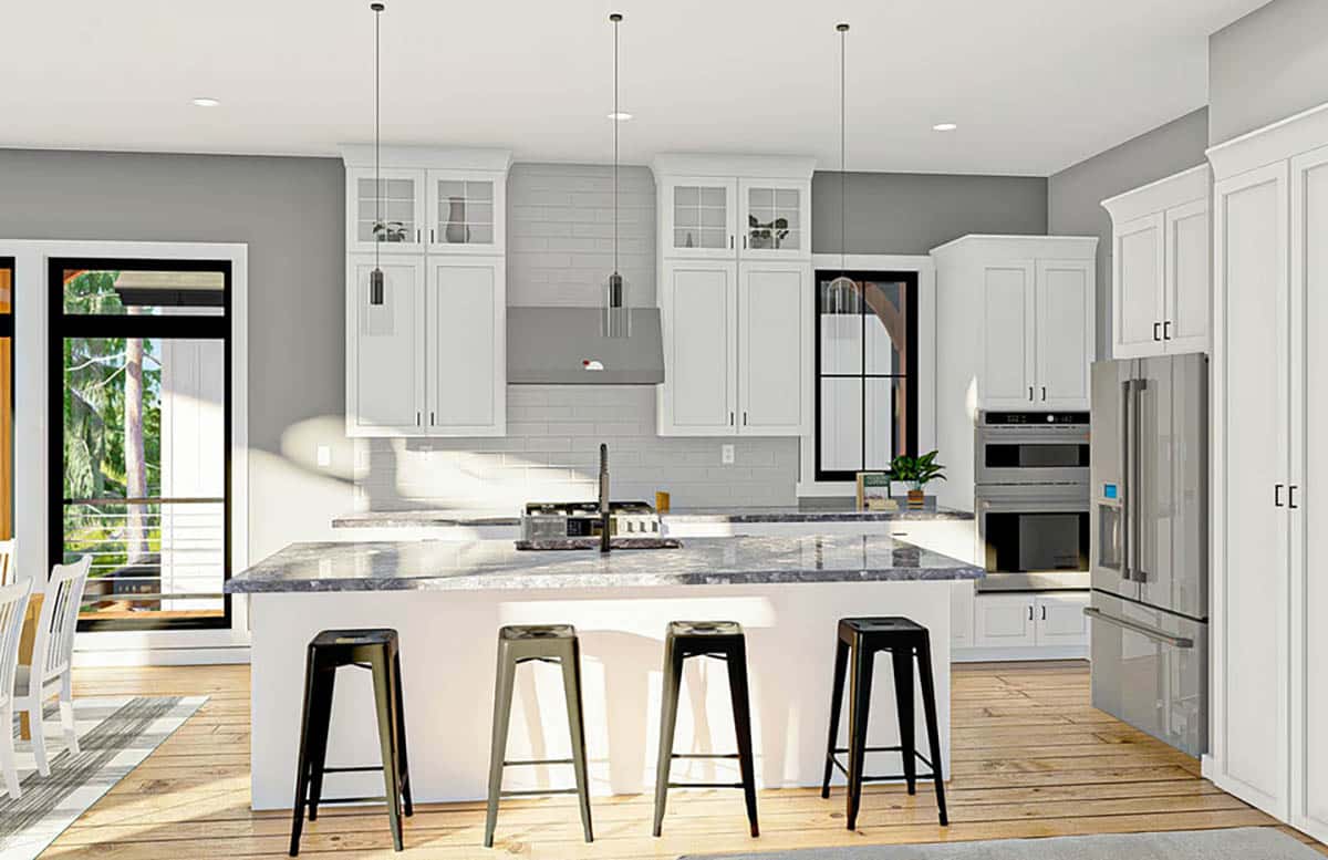 Open plan L-shape kitchen with white shaker cabinets and large island with bar stools